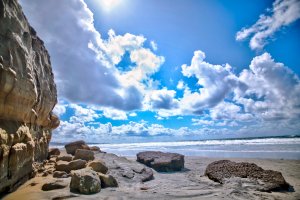 View of North Bluff Preserve cliffs and Pacific Ocean with clouds parting