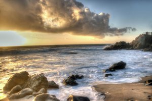 Giant cloud and rocks during sunset at Moss Cove